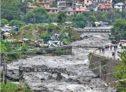  ?? —PTI ?? A swollen Beas river flows after heavy rains in the region, in Kullu district in Himachal Pradesh on Monday.