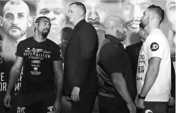  ?? — Reuters photo ?? David Haye (left) and Tony Bellew (right) during the press conference in east London.