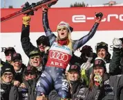  ?? Alessandro Trovati/Associated Press ?? Mikaela Shiffrin celebrates with the team after an alpine ski World Cup slalom in Are, Sweden on Saturday.