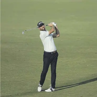  ?? ?? A relaxed Scott Jamieson posted 65 yesterday to sit in a tie for 11th at the halfway stage in Dubai