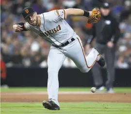  ?? Sean M. Haffey / Getty Images ?? Giants third baseman Evan Longoria, who had another hitless game, also had a rough night in the field, committing one of the team’s two errors.