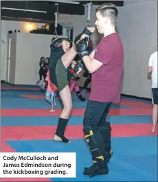  ??  ?? Cody McCulloch and James Edmindson during the kickboxing grading.