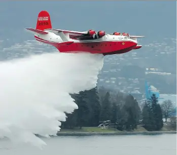  ?? JASON PAYNE/FILES ?? Martin Mars water bombers can carry almost 30,000 litres of water, with each drop covering about four acres. Coulson Group owns two of the four-engined machines that have helped fight B.C. wildfires.