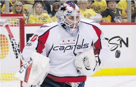  ?? GENE PUSKAR, THE ASSOCIATED PRESS ?? Capitals goalie Braden Holtby stops a shot during the second period of Game 6 against the Penguins on Monday.