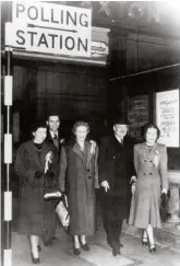  ??  ?? Clement Attlee (second right) emerges from a polling station during the snap election of 1951. His party polled a record number of votes but would be out of power for 13 years