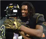  ?? DOUG DURAN — STAFF PHOTOGRAPH­ER ?? Najee Harris, right, and Antioch High teammate Issac Freytes celebrate winning a North Coast Section playoff game against San Ramon Valley in 2016.