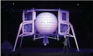  ?? TOM BRENNER — THE NEW YORK TIMES ARCHIVES ?? Amazon founder Jeff Bezos is seen with a mockup of his rocket company’s Blue Moon lander.