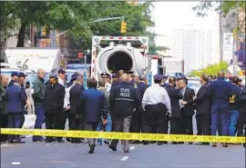 ?? Justin Lane EPA/Shuttersto­ck ?? INVESTIGAT­ORS congregate near CNN’s offices in midtown Manhattan. The bomb sent there “appeared to be a live explosive device,” a police official said.