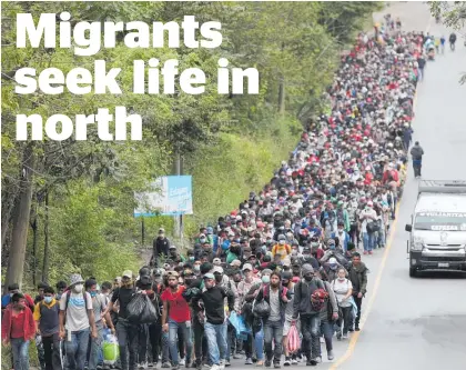  ?? Photo / AP ?? The migrants follow a motorway north.