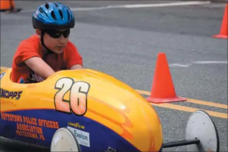  ?? MARIAN DENNIS — MEDIANEWS GROUP ?? Racers had a blast Saturday as they raced Soap Box cars down Wilson Street for a shot at going to Akron, Ohio, to represent Pottstown.