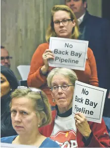  ?? STAFF PHOTO BY PATRICK WHITTEMORE ?? PROTEST: Back Bay residents show their disapprova­l yesterday for the approval of a gas main.