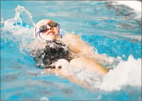  ?? Matthew Brown / Hearst Connecticu­t Media ?? Greenwich Academy’s Sophia Moore competes in the 200-yard medley relay against Sacred Heart Greenwich in 2019.