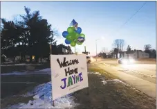  ?? Kerem Yucel / AFP / Getty Images ?? A “Welcome Home Jayme” sign displayed for Jayme Closs on Friday in Barron, Wis., one day after the missing teenager was found coming out of nearby woods with her hair matted and wearing oversized shoes.