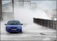  ??  ?? Waterlogge­d: High seas in Saltcoats, Ayrshire