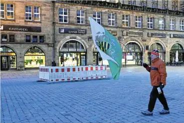  ?? /Reuters ?? Growing problem: A protester carries a flag of the ultra far-right Freie Sachsen (Free Saxony) at a demonstrat­ion in Chemnitz.