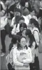  ?? LI YIBO / XINHUA ?? Medical students wait in line at a career fair for grassroots medical facilities in Xi’an, Shaanxi province, earlier this month.