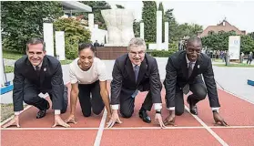 ?? Jean-Christophe Bott/ Keystone via AP ?? From left, Mayor Eric Garcetti of Los Angeles, U.S. sprinter Allyson Felix, Internatio­nal Olympic Committee President Thomas Bach of Germany and former U.S. sprinter Michael Johnson pose on the 200-meter track during a visit of the Los Angeles 2024 Candidate City delegation Monday at the Olympic Museum in Lausanne, Switzerlan­d.