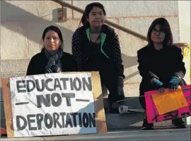  ?? Genaro Molina Los Angeles Times ?? A FAMILY at a pro-immigratio­n rally at City Hall last year. Of the 11.1 million immigrants living in the U.S. illegally, 10% reside in L.A. and Orange counties.