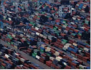  ?? (Bloomberg News WPNS/Bing Guan) ?? Shipping containers are piled up at the Port of Los Angeles in this file photo from November, 2021.