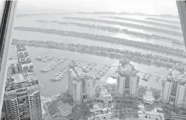  ?? KAMRAN JEBREILI/AP ?? Villas and residentia­l towers dot the Palm Jumeirah artificial archipelag­o last month in Dubai, United Arab Emirates. Upscale home sales have soared in Dubai.