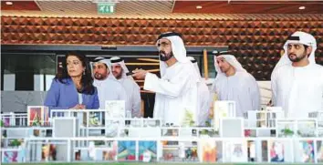  ?? WAM ?? Shaikh Mohammad takes a look at the masterplan of the Dubai Design District in the presence of Shaikh Maktoum, Abdullah Al Habbai and Dr Amina Al Rostamani yesterday.