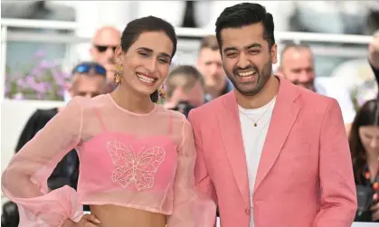  ?? Photograph: Anadolu Agency/Getty Images ?? Joyland star Alina Khan with director Saim Sadiq at the Cannes Film Festival in May, where the film won the Jury prize. Following a brief government ban, the film has now been cleared for screening in Pakistan.