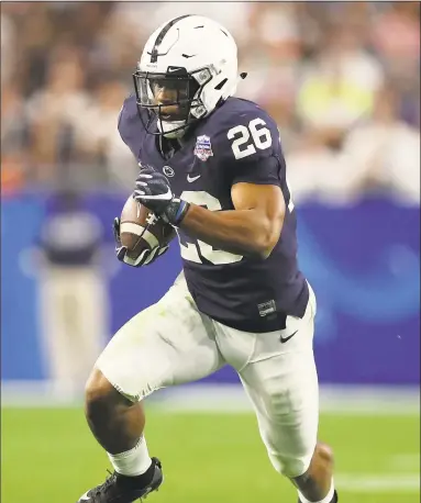  ?? Christian Petersen / Getty Images ?? Running back Saquon Barkley, pictured here on Dec. 30 during the PlayStatio­n Fiesta Bowl, is worthy of a high first-round pick.