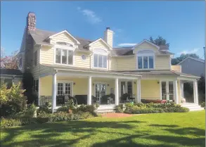  ?? New England Land Company / Contribute­d photo ?? The 50-foot rear deck at 22 Old Clubhouse Road, Greenwich, is completely protected from the elements — rain and harsh summer sun — with a roof over it. The four-bedroom colonial is located on a 0.47-acre lot, with direct water frontage, in the Shorelands Associatio­n. New England Land Company is the listing brokerage for $3.875 million.