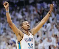  ?? RONALD MARTINEZ/ GETTY IMAGES ?? Kevin Durant of the Oklahoma City Thunder celebrates as the final seconds tick down in Game 6 of the Western Conference Final on Wednesday. The Thunder erased an 18- point deficit and beat the San Antonio Spurs 107- 99 to advance to the NBA Final.