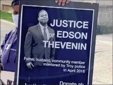  ?? Robert Gavin / Times Union ?? Protesters hold signs outside Rensselaer County Court as opening statements began earlier this year in the trial of former county District Attorney Joel Abelove, who was charged with first-degree perjury, a felony, and misdemeano­r charges of official misconduct in connection with his handling of the 2016 fatal police shooting of Edson Thevenin. Abelove was acquitted of the charges.