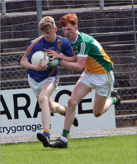  ??  ?? Kevin Quinn of Wicklow is challenged by Harry Balsiger of Offaly.