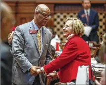  ?? BOB ANDRES / ROBERT.ANDRES@AJC.COM ?? Rep. Sharon Cooper, R-Marietta, is congratula­ted by Rep. Calvin Smyre, D-Columbus, after the passage of her bill to provide additional measures for senior care. HB987 passed 160-1.