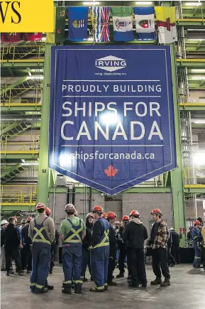  ?? DARREN CALABRESE / THE CANADIAN PRESS ?? Workers gather in the assembly hall at Halifax’s Irving Shipyard Friday, following the announceme­nt that the Navy will receive a sixth Arctic and offshore patrol ship.