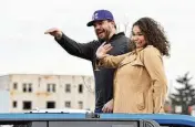  ?? NICK GRAHAM / STAFF ?? Kyle Schwarber and his wife, Paige, wave during the 2022 Middletown Santa Parade. A Middletown native, Schwarber served as grand marshal.