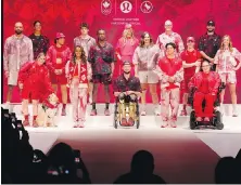  ?? CHRIS YOUNG, THE CANADIAN PRESS ?? Athletes show off the collection Tuesday during the unveiling of the Team Canada Lululemon athlete kit for the Paris Olympic and Paralympic Games.