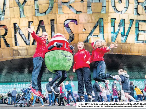 ??  ?? > May 2019: Mr Urdd celebrates with athletes in Cardiff Bay. Mr Urdd will be the new team mascot for the Birmingham Commonweal­th Games 2022