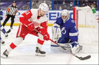  ??  ?? Tampa Bay Lightning goaltender Christophe­r Gibson, of Finland, makes a save against Detroit Red Wings’ Filip Zadina, of Czech Republic, during the first period of an NHL hockey game, on April 4, in Tampa, Florida. (AP)