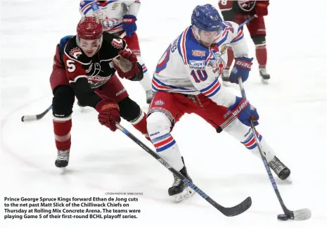  ?? CITIZEN PHOTO BY JAMES DOYLE ?? Prince George Spruce Kings forward Ethan de Jong cuts to the net past Matt Slick of the Chilliwack Chiefs on Thursday at Rolling Mix Concrete Arena. The teams were playing Game 5 of their first-round BCHL playoff series.