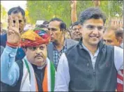  ?? PTI ?? Rajasthan Congress chief Sachin Pilot and Congress candidate Raghu Sharma flash the victory sign after latter’s victory in Ajmer bypoll on Thursday.