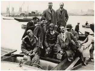  ??  ?? Below: Amelia Earhart and pilot Wilmer Stultz, both wearing aviator clothing, in Southampto­n, England, following the completion of their transatlan­tic flight in 1928.