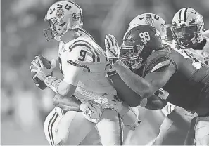  ?? GREGORY SHAMUS/GETTY IMAGES ?? LSU and quarterbac­k Joe Burrow dropped to No. 7 in the CFP rankings after losing to Alabama last week.