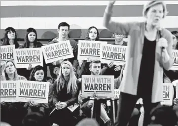  ?? JOHN J. KIM/CHICAGO TRIBUNE ?? Supporters listen as presidenti­al candidate Sen. Elizabeth Warren campaigns on Feb. 1 in Cedar Rapids, Iowa.