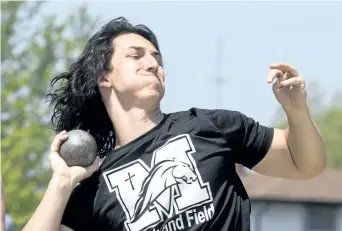  ?? JULIE JOCSAK/POSTMEDIA NEWS ?? Danial Burlak of St. Michael High School competes in the junior mens shot put during the SOSSA Track and Field meet at the Niagara Olympic Club on Thursday.