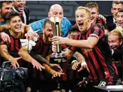  ?? CURTIS COMPTON/AJC 2019 ?? Along with a Campeones Cup, captain Jeff Larentowic­z (forefront) won an MLS Cup and a U.S. Open Cup with Atlanta United in 437 appearance­s.