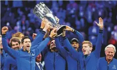  ?? AP ?? Team Europe celebrate with the Laver Cup after defeating Team World in Chicago on Sunday.