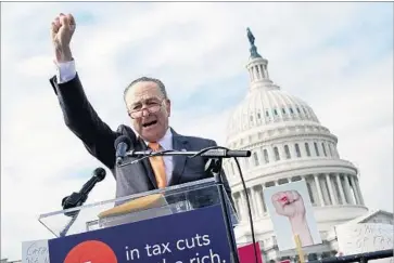  ?? Chip Somodevill­a Getty I mages ?? SENATE Minority Leader Charles E. Schumer ( D- N. Y.) addresses a rally against the GOP’s tax legislatio­n.