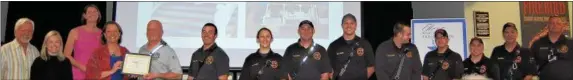  ??  ?? The Saratoga Springs Fire Department was recognized for their efforts fighting the early Thanksgivi­ng Day fire at 26 Caroline St. Shown, from left, are former Mayor Scott Johnson, Chelsea Hoopes Silver, Saratoga Sprigns Preservati­on Foundation...