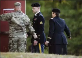  ?? THE ASSOCIATED PRESS ?? Sgt. Bowe Bergdahl, center, arrives to the Fort Bragg courtroom facility for a sentencing hearing on Friday in Fort Bragg, N.C.