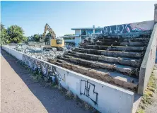  ??  ?? Workers continue to demolish the old stadium at Victoria High School in preparatio­ns for a $7 million upgrade.