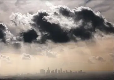  ?? Al Seib Los Angeles Times ?? A LIGHT RAIN that fell on Southern California in late November was a rarity so far this water year. Downtown Los Angeles has not had a monthly rain total of more than half an inch for 10 months in a row.